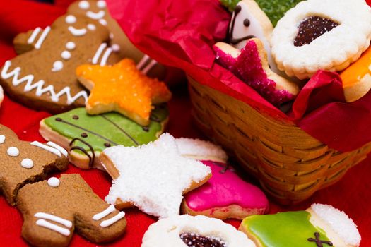 Assorted christmas cookies on red background.