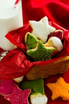 Assorted christmas cookies on red background.