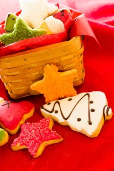 Assorted christmas cookies on red background.