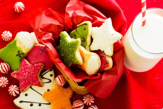 Assorted christmas cookies on red background.