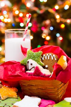 Assorted christmas cookies on red background.