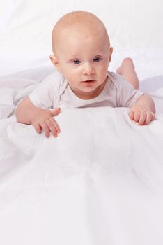 The world holds many wonders ahead for him. an adorable baby boy in a studio