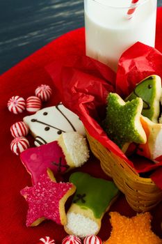 Assorted christmas cookies on red background.