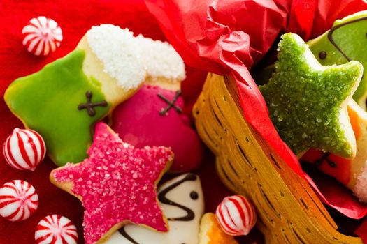 Assorted christmas cookies on red background.