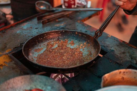 Frying dal pulses in a fry pan. Dal Tadka or Daal fry Pakstani and indian cuisine tasty food.