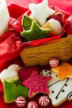 Assorted christmas cookies on red background.