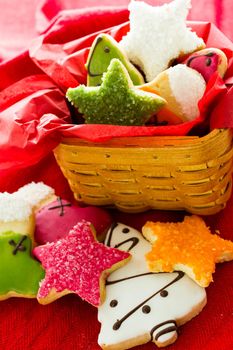 Assorted christmas cookies on red background.