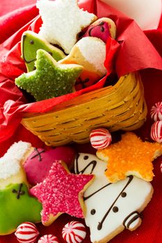 Assorted christmas cookies on red background.