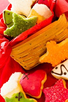 Assorted christmas cookies on red background.