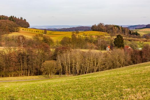 Rural scene with hills, valleys, trees and bushes with good distant views