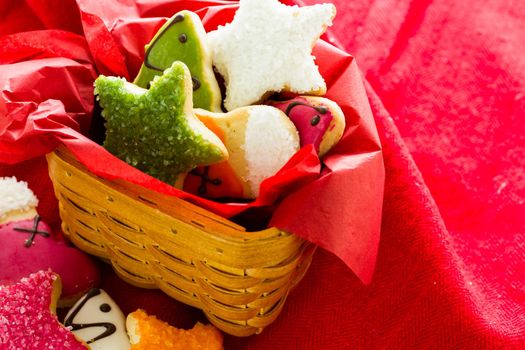 Assorted christmas cookies on red background.