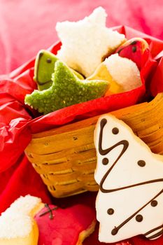 Assorted christmas cookies on red background.