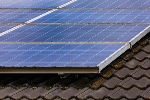 Solar panels on the private roof convert sunlight directly into electrical energy via photovoltaic cells