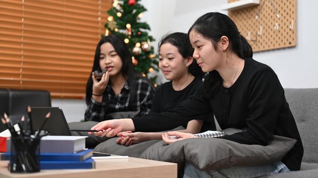 Asian students online learning class at home together.