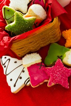 Assorted christmas cookies on red background.