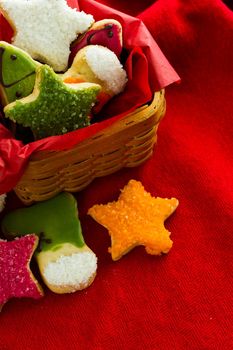 Assorted christmas cookies on red background.