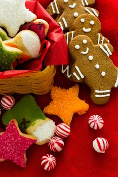 Assorted christmas cookies on red background.