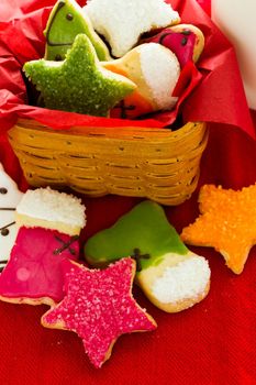 Assorted christmas cookies on red background.