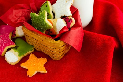 Assorted christmas cookies on red background.