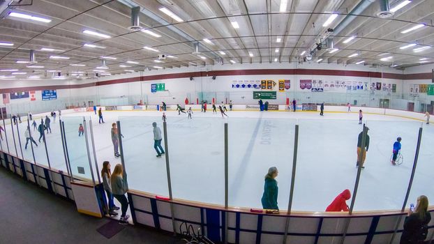 Denver, Colorado, USA-January 12, 2020 - Public ice skating session on the indoor ice skating rink.