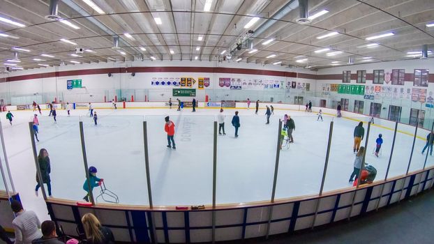 Denver, Colorado, USA-January 12, 2020 - Public ice skating session on the indoor ice skating rink.