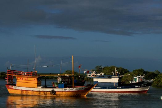 porto seguro, bahia / barazil - august 25, 2008: fishing boats are seen near the port in the city of Porto Seguro, in the south of Bahia.