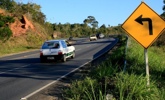 eunapolis, bahia / brazil - august 26, 2008: Vehicles drive along a dangerous curve road on the BR 101 highway in Eunapolis.