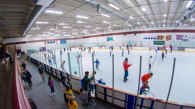Denver, Colorado, USA-January 12, 2020 - Public ice skating session on the indoor ice skating rink.
