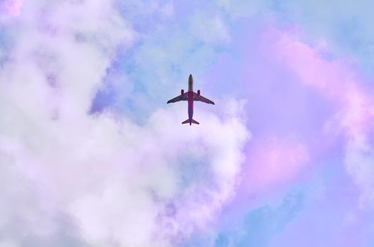 a flat surface on which a straight line joining any two points on it would wholly lie. Red passenger plane in blue sky with pink clouds