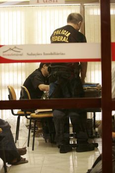 porto seguro, bahia / brazil - august 6, 2009: Federal Police agents are seen during an investigation operation in the city of Porto Seguro, in the south of Bahia.