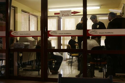 porto seguro, bahia / brazil - august 6, 2009: Federal Police agents are seen during an investigation operation in the city of Porto Seguro, in the south of Bahia.