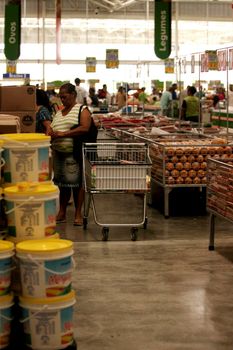 eunapolis, bahia / brazil - august 10, 2009: customers are seen pushing a shopping cart at the Atacadao supermarket in the city of Eunapolis, in southern Bahia.