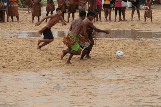 santa cruz cabralia, bahia, brazil - april, 2009: Indians of the Pataxo ethnicity playing a soccer match during indigenous games in the Coroa Vermelha village in southern Bahia.