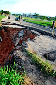 eunapolis, bahia / brazil - june 8, 2009: Crater is seen along the BR 101 highway in Eunapolis. The hole is formed by erosion of the ground.