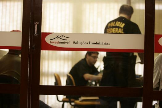 porto seguro, bahia / brazil - august 6, 2009: Federal Police agents are seen during an investigation operation in the city of Porto Seguro, in the south of Bahia.