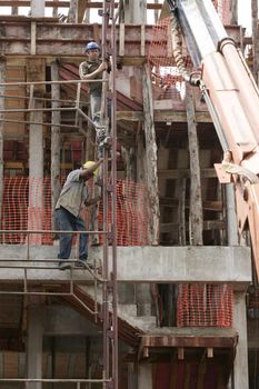 eunapolis, bahia, brazil - august 25, 2009: Construction workers working on construction of a building in the city of Eunapolis.