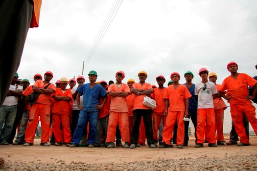 eunapolis, bahia / brazil - april 29, 2009: construction workers are seen during an assembly with a union leader to promote serious in the category.

