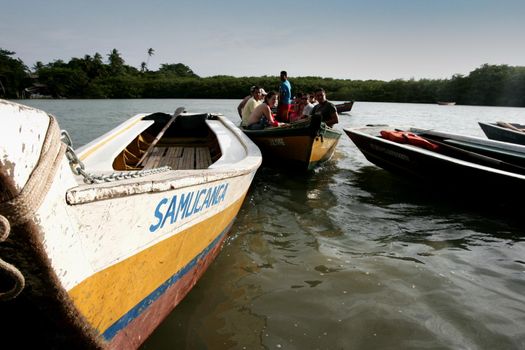 porto seguro, bahia, brazil - december 30, 2009: Canoes used to cross the Caraiva River in the countryside of the city of Porto Seguro.

