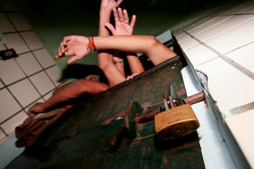 teixeira de freitas, bahia / brazil - november 24, 2009: prisoners are seen in cells in the Teixeira de Freitas city complex.
