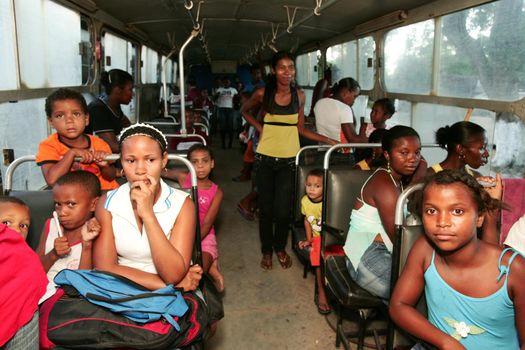 nova vicosa, bahia, brazil - december 3, 2009: children from the quilombola community Euvecia are seen on a school bus.