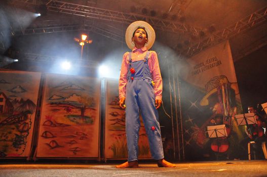 vitoria da conquista, bahia, brazil - november 1, 2011: Child performing on stage in theater in the city of Vitoria da Conquista.