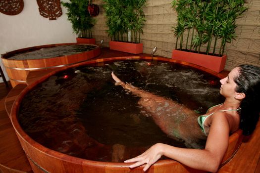 porto Seguro, bahia / brazil - january 2, 2010: Young man is seen in a hot tub in a hotal in the city of Porto Seguro, in the south of Bahia.