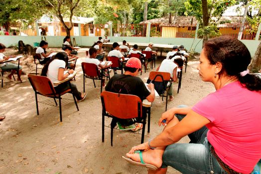 porto Seguro, bahia / brazil - january 20, 2009: public school students attend class on the school patio in the Trancoso district, municipality of Porto Seguro, in southern Bahia.