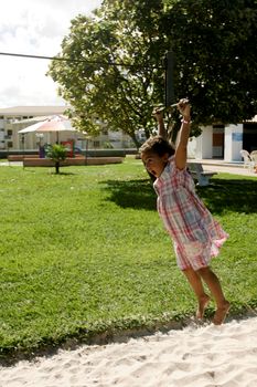 salvador, bahia / brazil - june 27, 2009: child is seen playing on zip lines in a condominium boat in the city of Salvador.