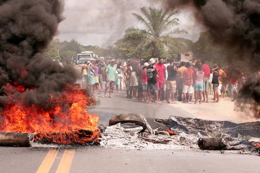 porto seguro, bahia, brazil - march 2, 2010: Protesters protest on federal highway BR 367 and set fire to the road in southern Bahia.