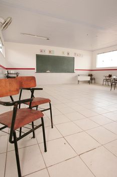 eunapolis, bahia, brazil - março 3, 2010: School desks in a classroom of a public school in the city of Eunapolis, in southern Bahia.