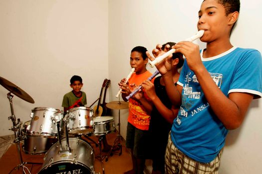 porto seguro, bahia / brazil - october 17, 2009: teenagers are seen during music class at a non-governmental organization in the city of Porto Seguro.