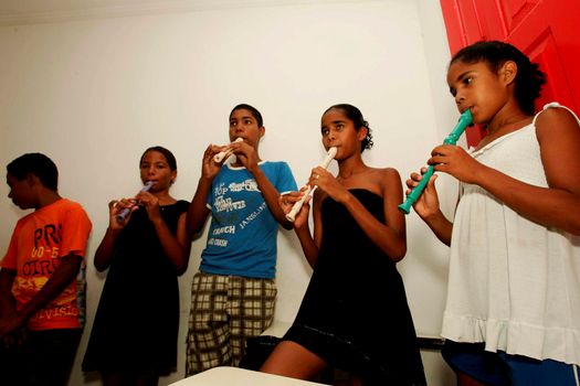 porto seguro, bahia / brazil - october 17, 2009: teenagers are seen during music class at a non-governmental organization in the city of Porto Seguro.