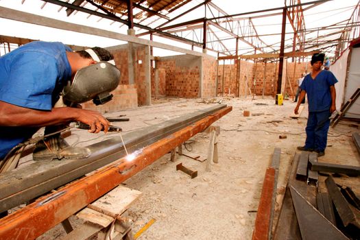 porto seguro, bahia, brazil - november 10, 2010: civil construction workers are seen working on renovating the airport in the city of Porto Seguro, in southern Bahia.