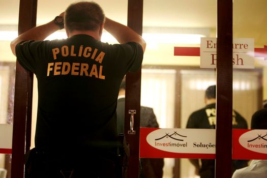 porto seguro, bahia / brazil - august 6, 2009: Federal Police agents are seen during an investigation operation in the city of Porto Seguro, in the south of Bahia.